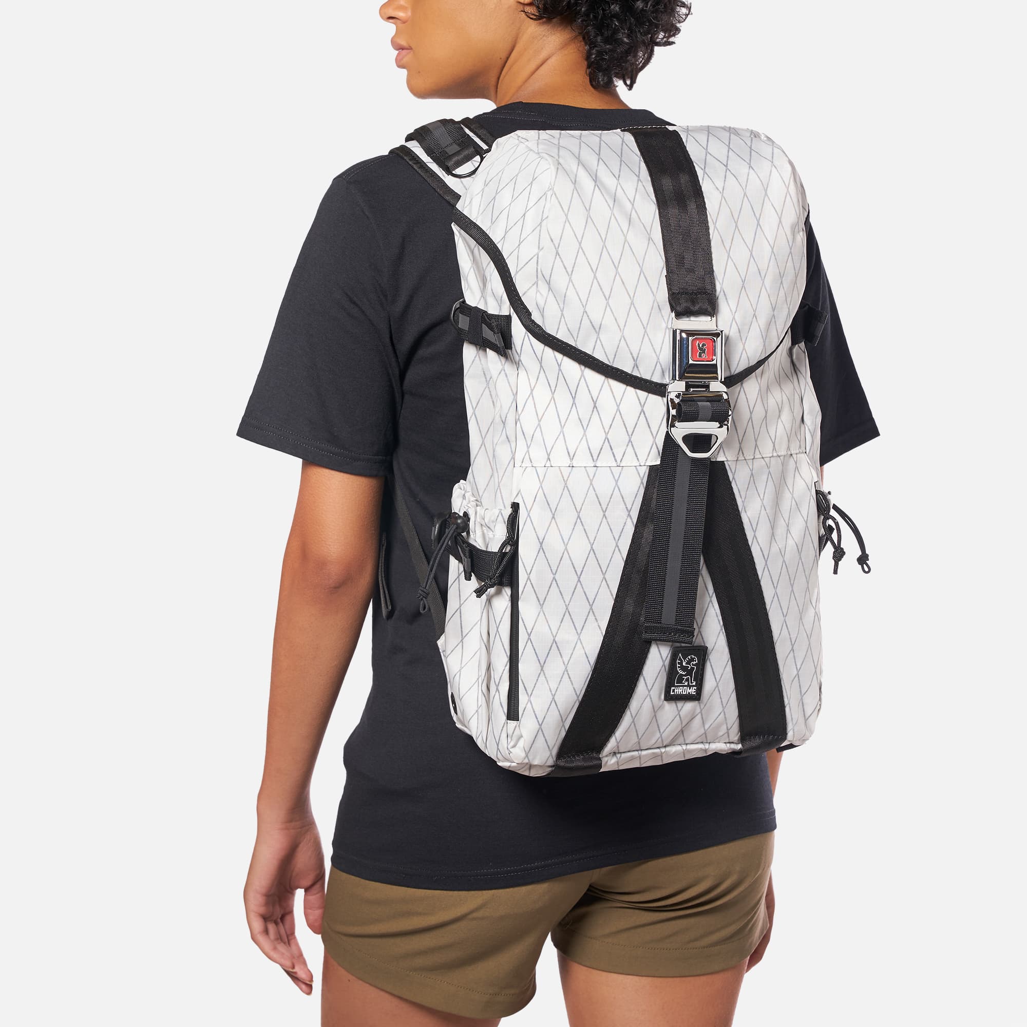 Tensile Ruckpack in white on a woman #color_white