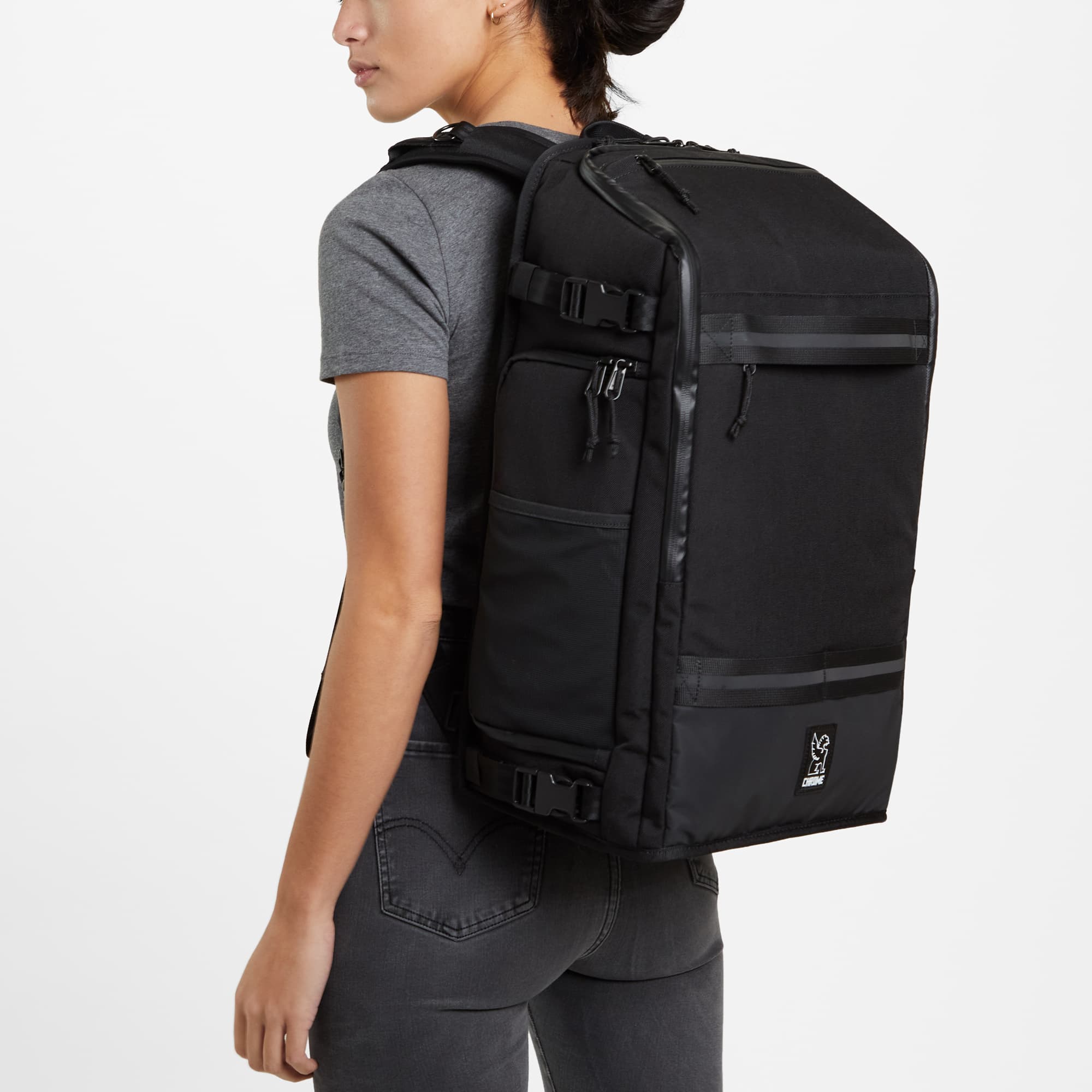 Niko camera tech backpack in black worn by a woman