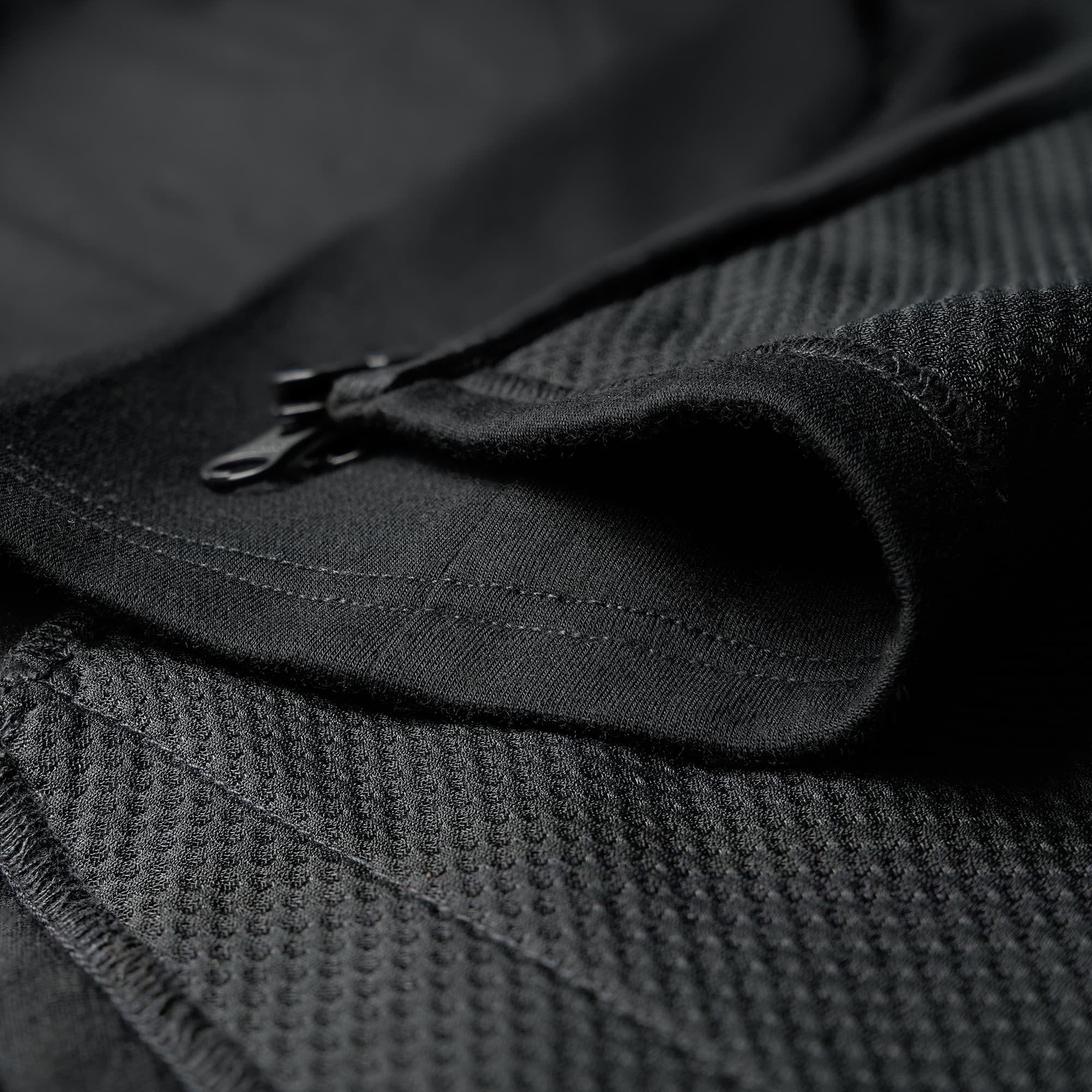 Women's Merino blend performance hoodie in black close up fabric
