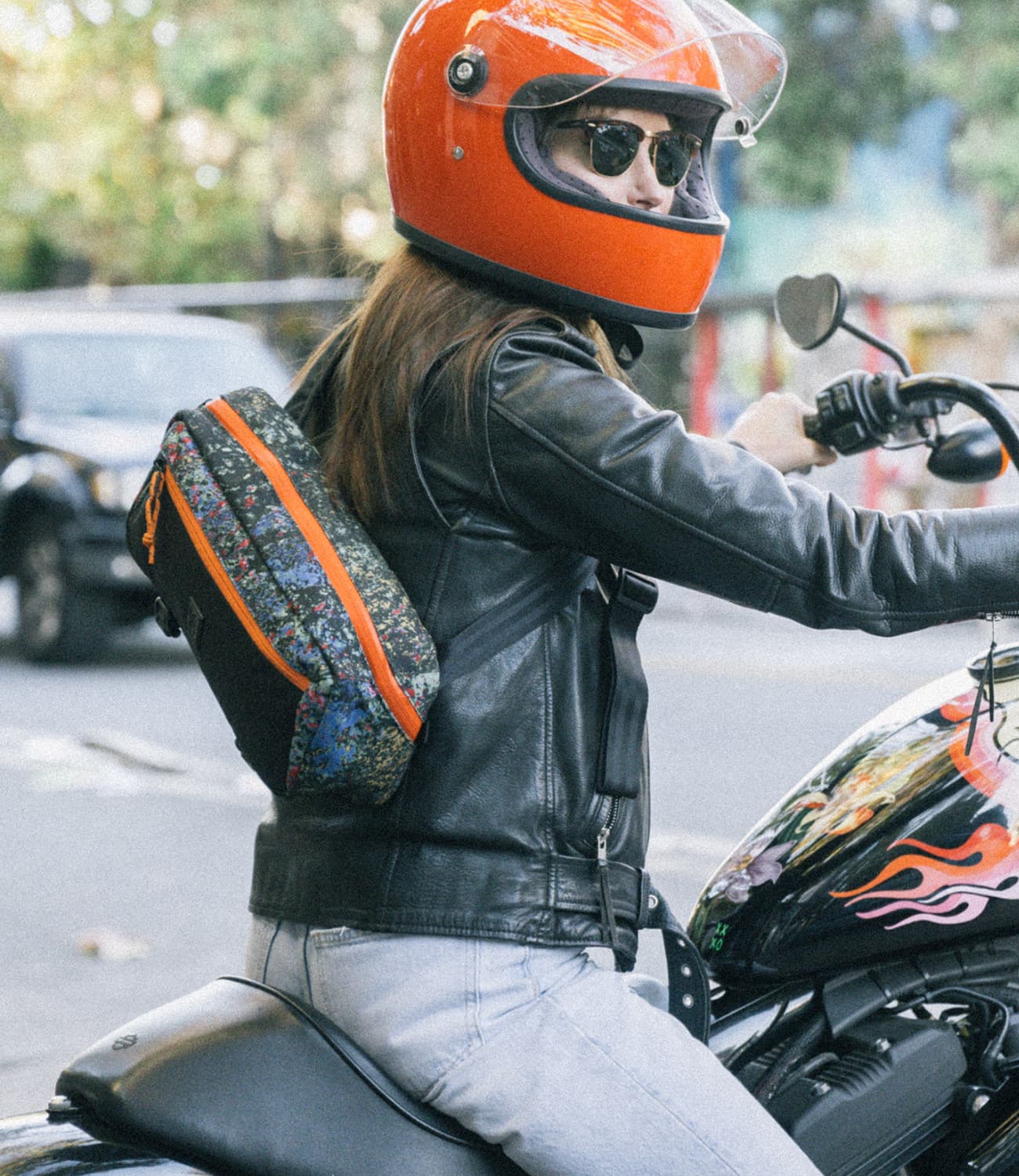 Mini Kadet Sling bag worn by a person on a motorcycle
