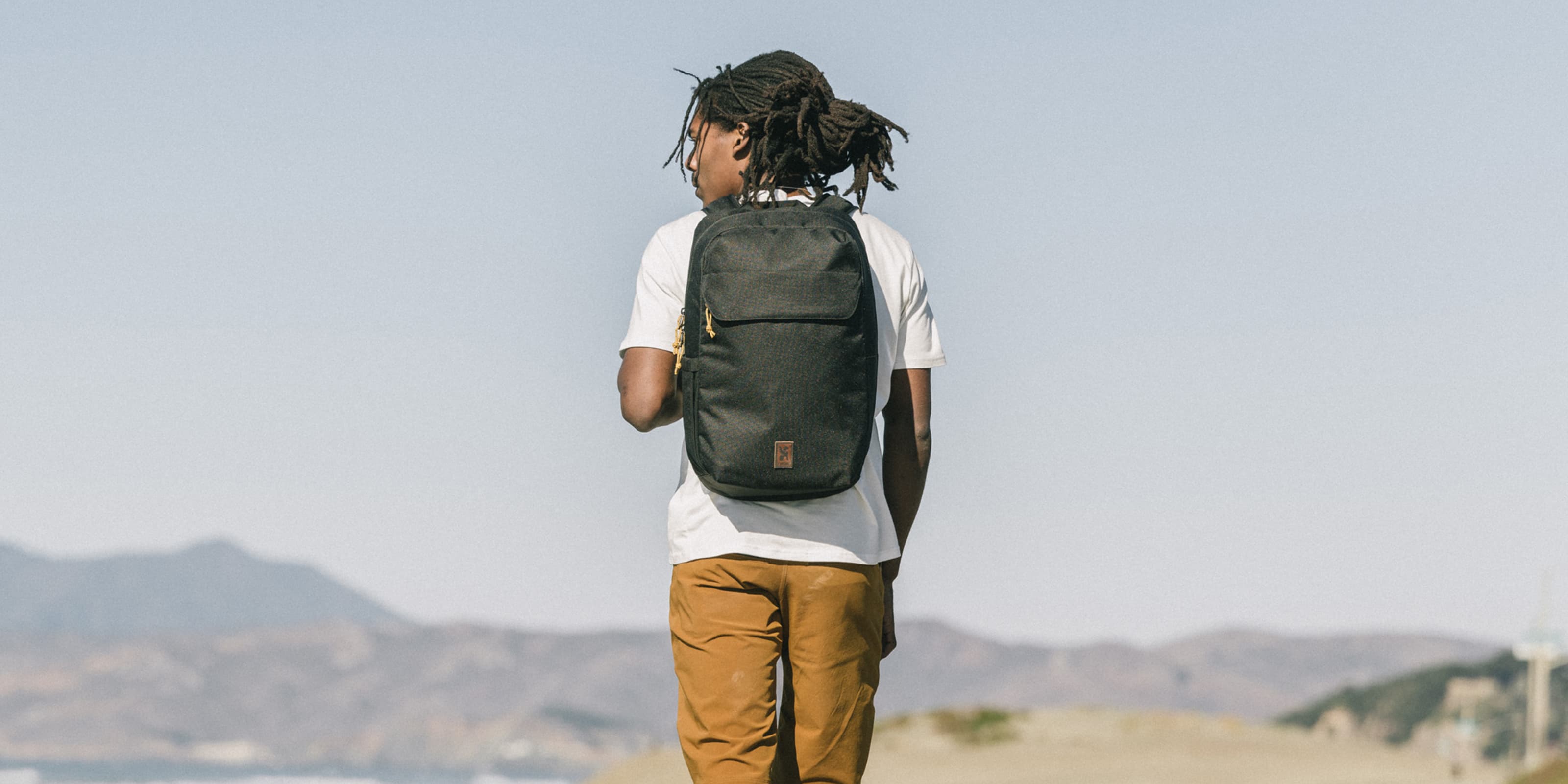 Water-resistant 23L Ruckas Backpack worn by a person walking