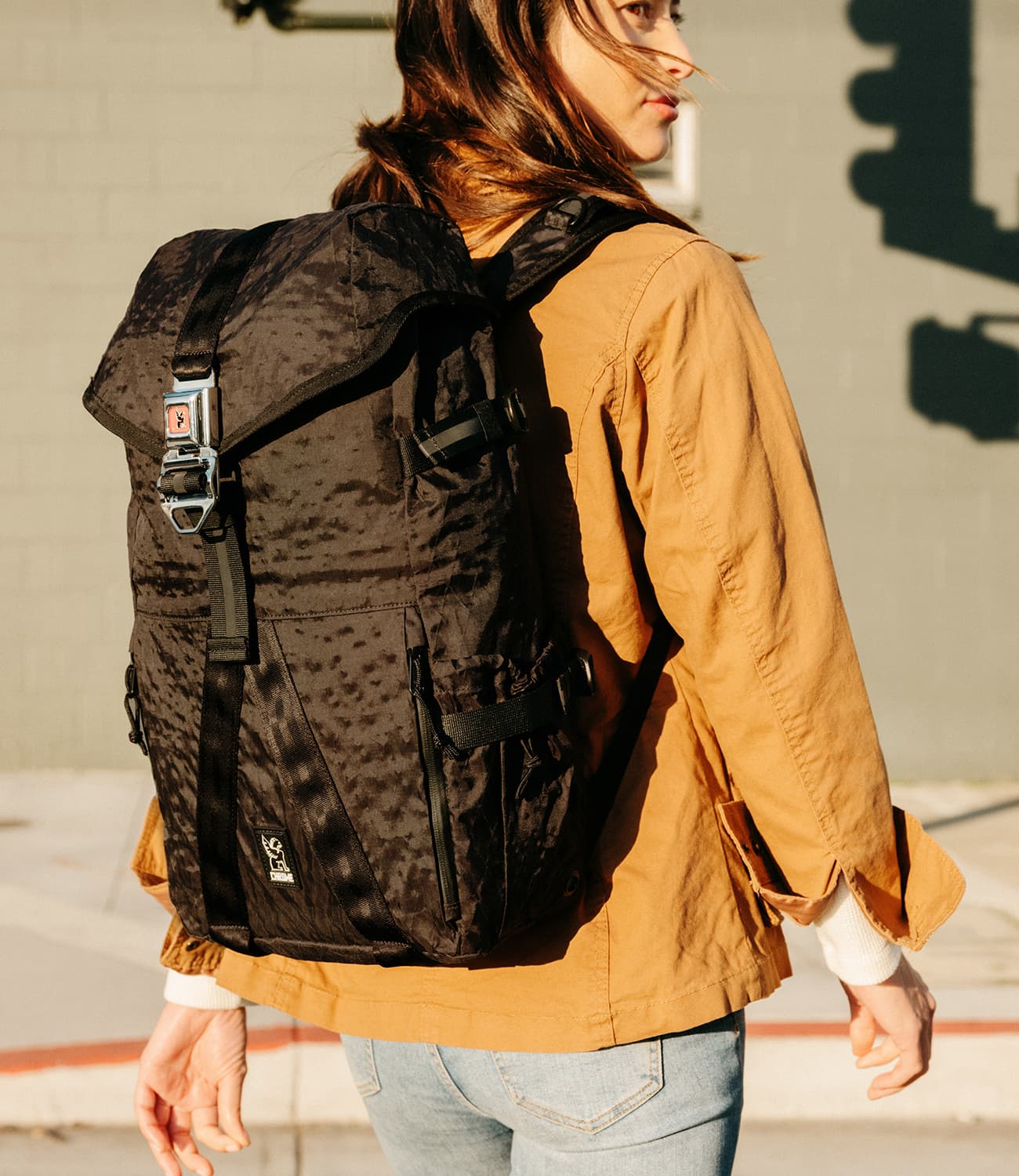 Tensile Ruckpack in black worn by a woman mobile image size